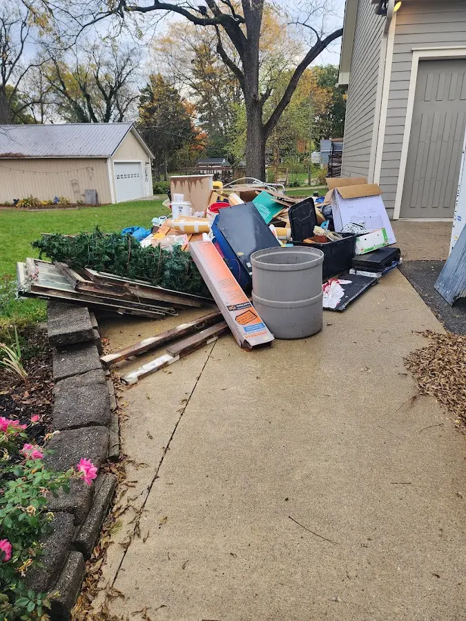 Dumpster being loaded with debris for Commercial Dumpster Rental in New Hanover